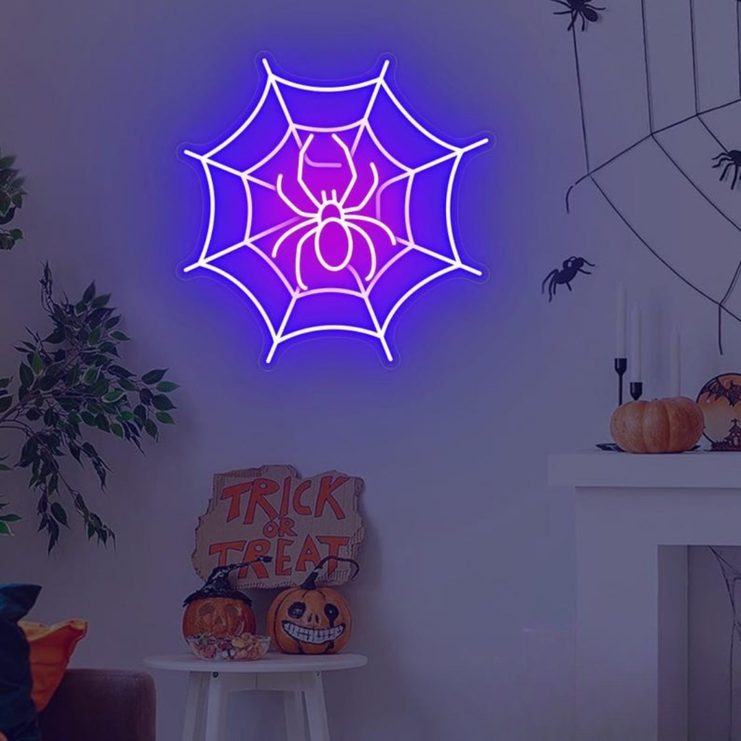 Spider web neon sign by Neon.outshine in glowing  LED Lights mounted on clear acrylic in a dark Halloween room.