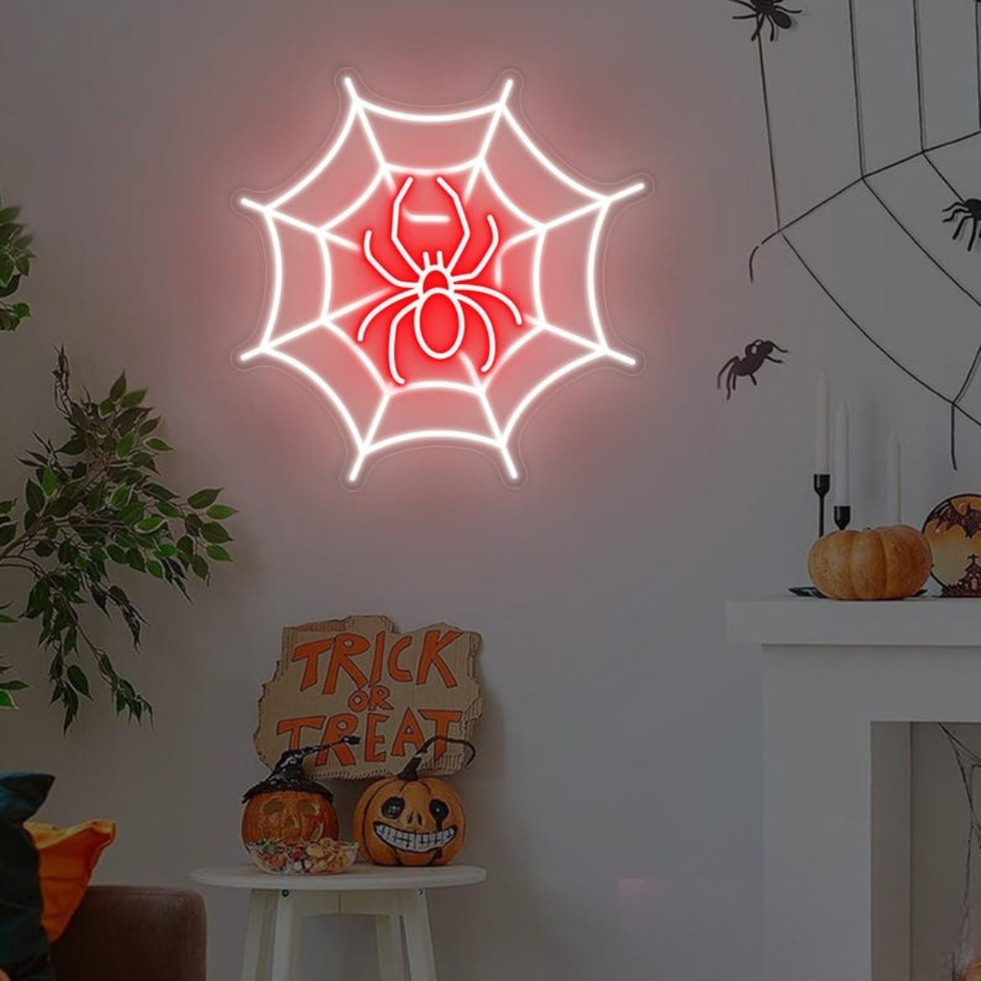 Spider web neon sign by Neon.outshine in glowing  LED Lights mounted on clear acrylic in a dark Halloween room.