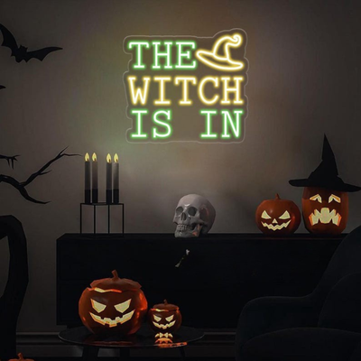 The Witch Is In LED Halloween neon sign by Neon.Outshine, glowing in bright colors 