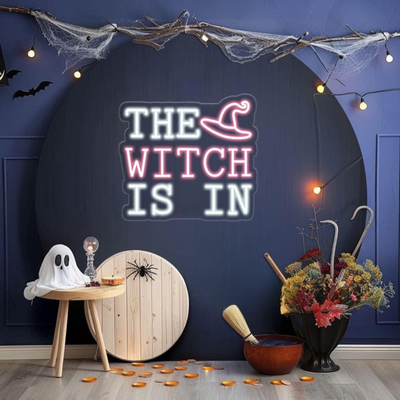 The Witch Is In LED Halloween neon sign by Neon.Outshine, glowing in bright colors 