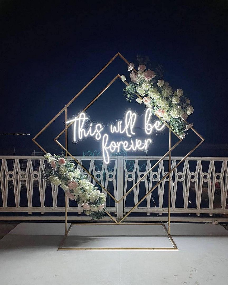 This Will Be Forever Wedding Neon Sign by Neon.Outshine glowing beautifully behind the couple’s wedding table.