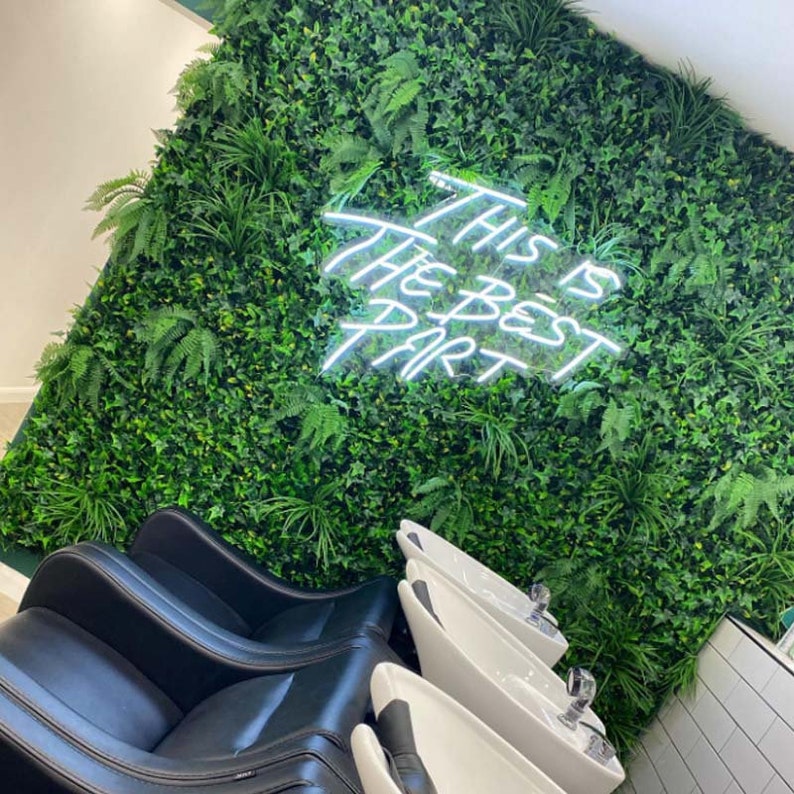 This is the Best Part” neon sign in vibrant LED lighting, mounted on a clear acrylic board, glowing in a stylish indoor space – Neon.Outshine 