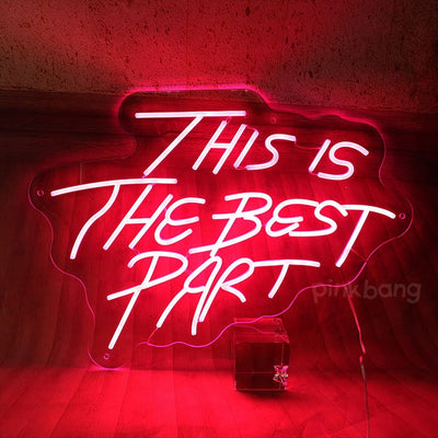 This is the Best Part” neon sign in vibrant LED lighting, mounted on a clear acrylic board, glowing in a stylish indoor space – Neon.Outshine 