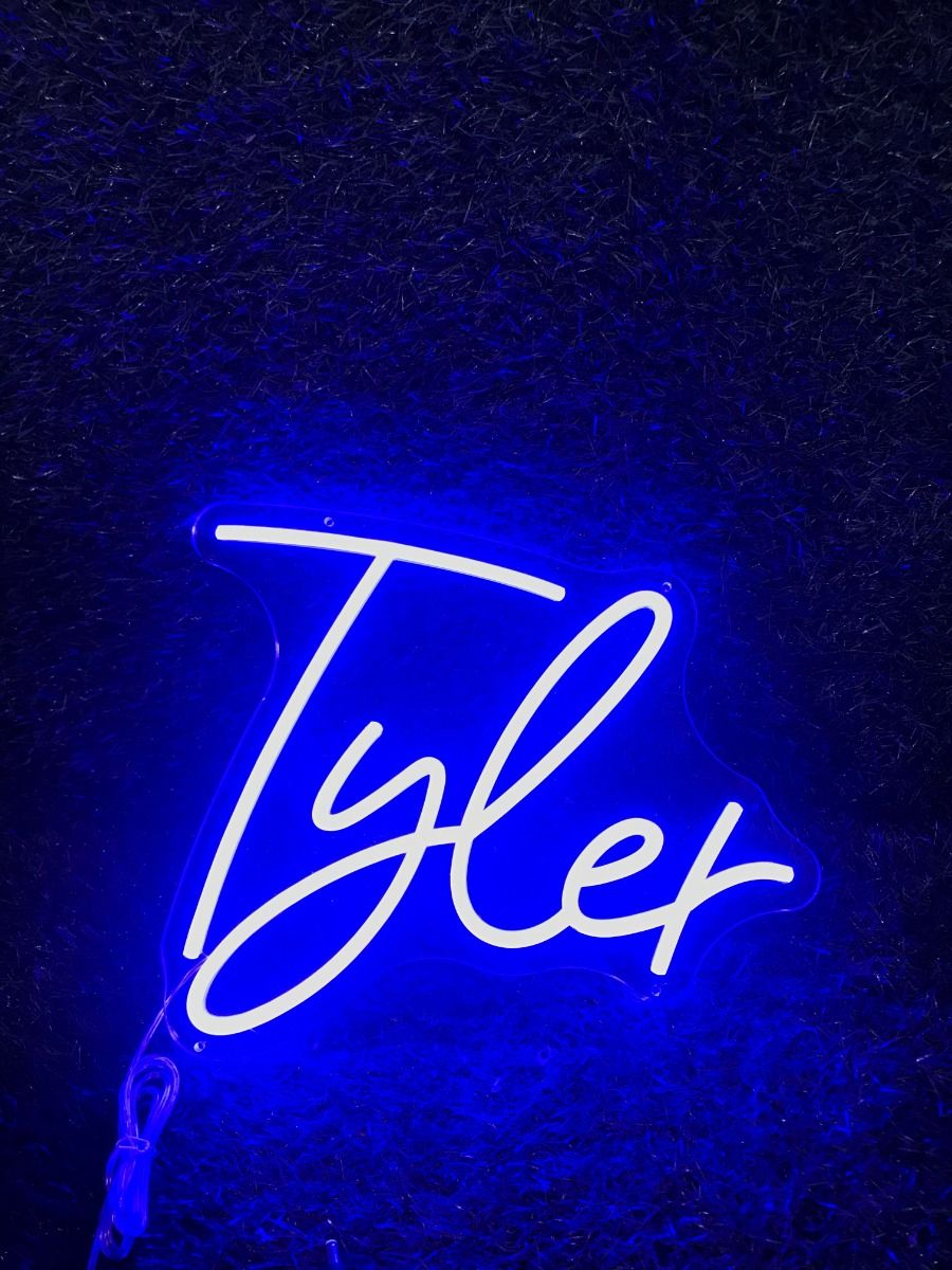 Tyler' LED neon sign glowing in blue, mounted on a dark wall – by Neon.Outshine.