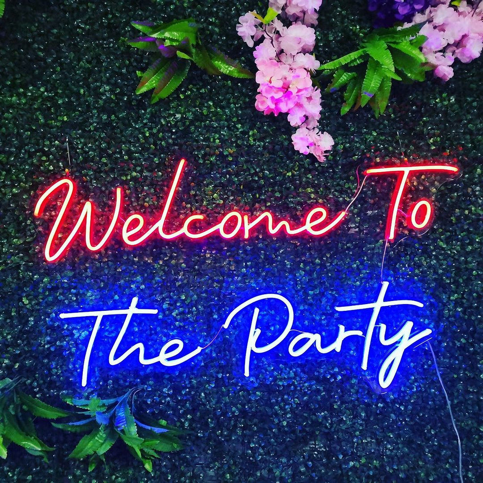 Welcome to the Party” neon sign in glowing LED, mounted on clear acrylic – vibrant event and party décor from Neon.Outshine.