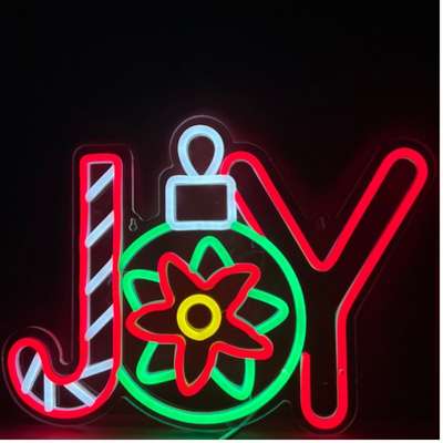 Winter Joy Christmas Neon Sign by Neon.Outshine glowing in festive colors for holiday décor.