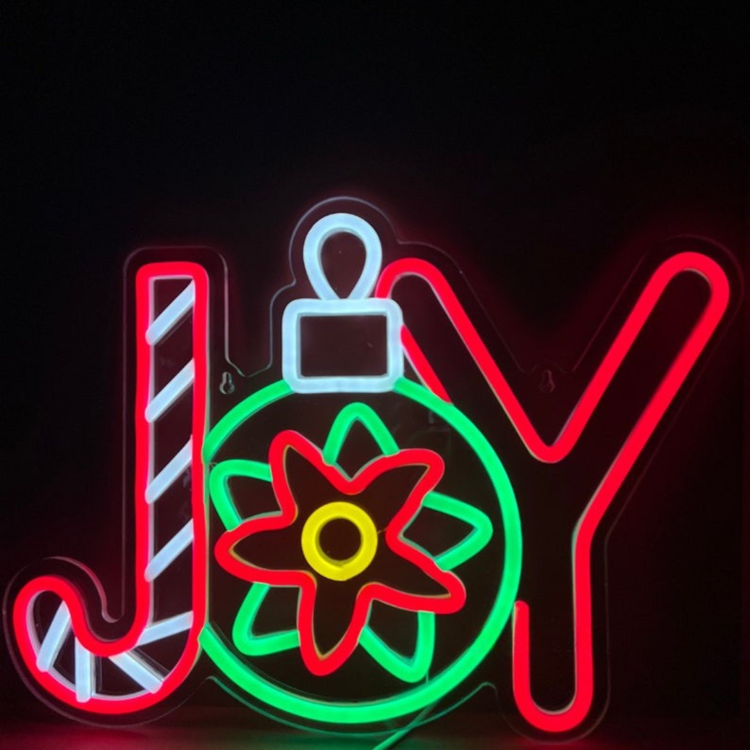 Winter Joy Christmas Neon Sign by Neon.Outshine glowing in festive colors for holiday décor.