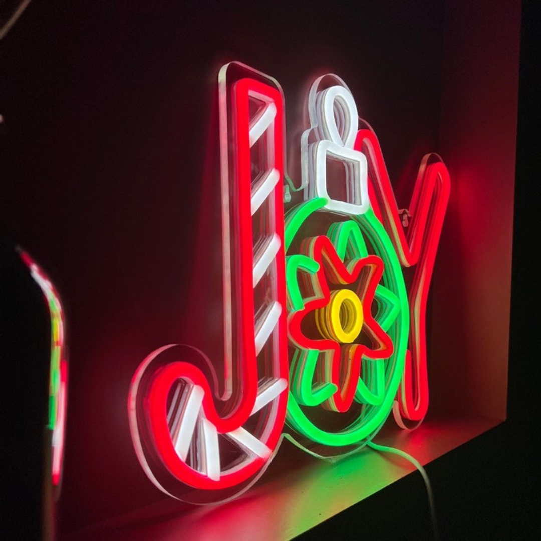 Winter Joy Christmas Neon Sign by Neon.Outshine glowing in festive colors for holiday décor.